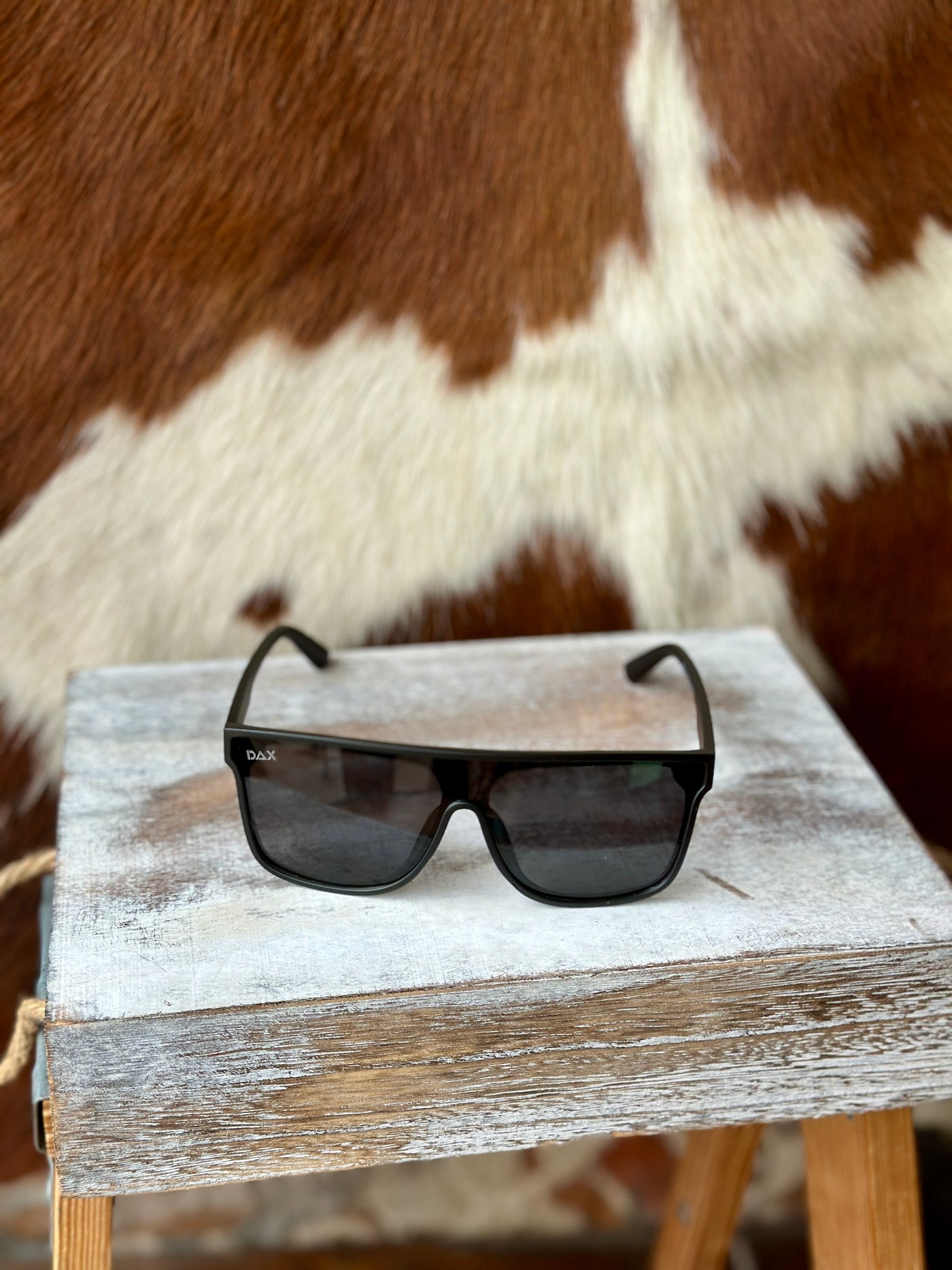 Western-inspired black sunglasses for bold cowgirl style.