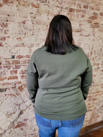 Close-up of the backside of the olive green Make Your Own Luck Crewneck.