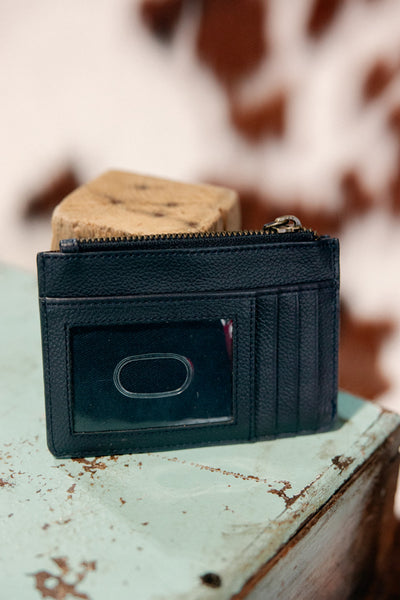 Black tooled leather cardholder featuring three card slots and an ID window.