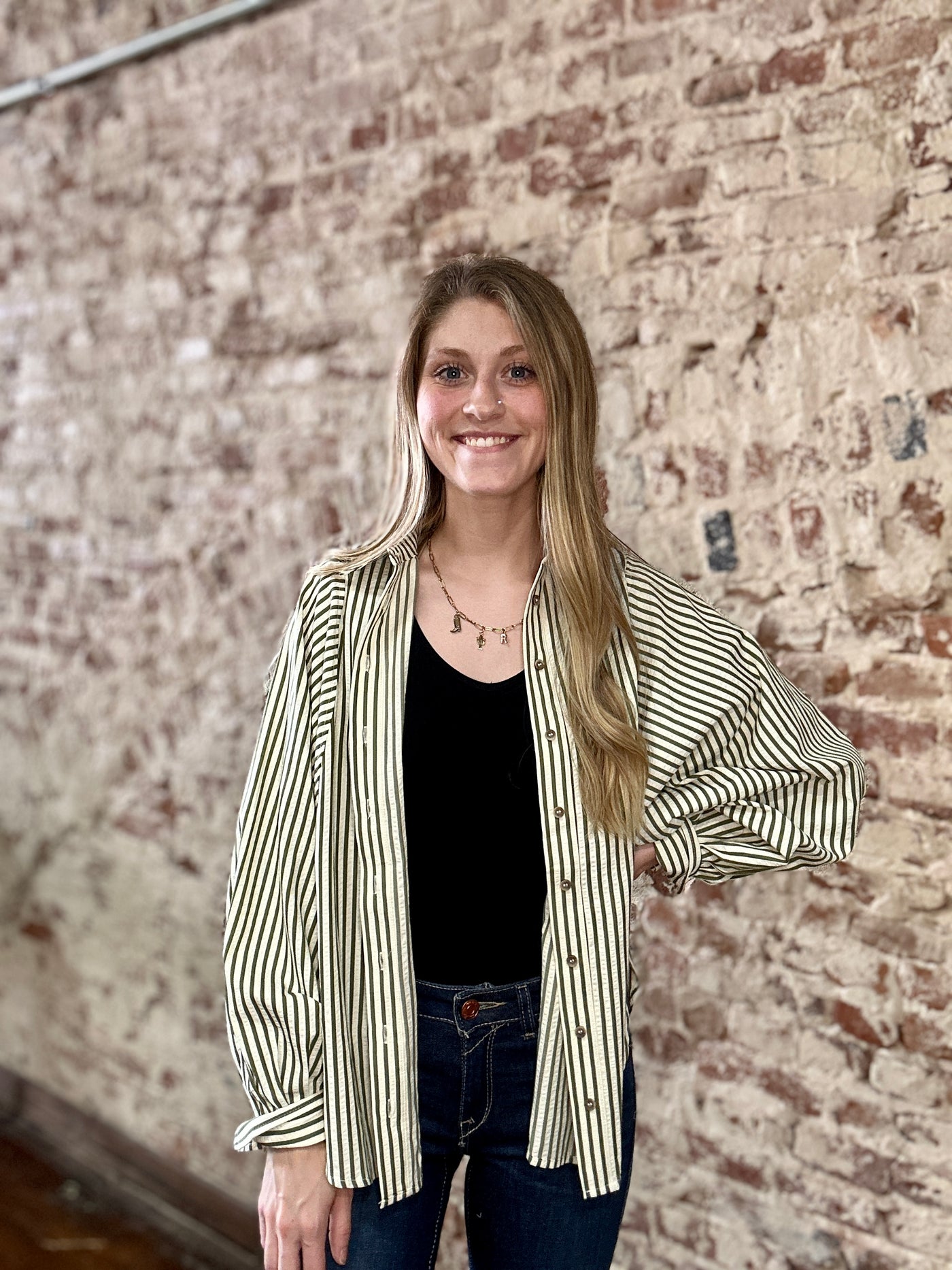 Model at Broker Leather wearing the Mandy Button Down Stripe Shirt, styled true to size for a slim, tailored fit.