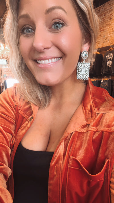 Elegant Marilyn Concho Earrings modeled by Broker Leather owner, Brianne Huiskamp to show size reference.