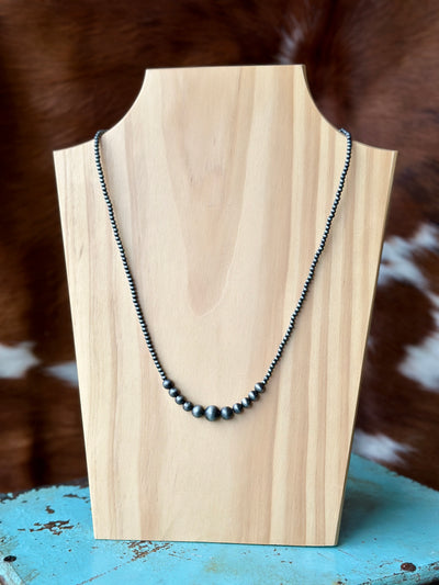 Marissa Faux Navajo Pearl Necklace with a classic design of evenly spaced faux pearls, offering timeless Western elegance.