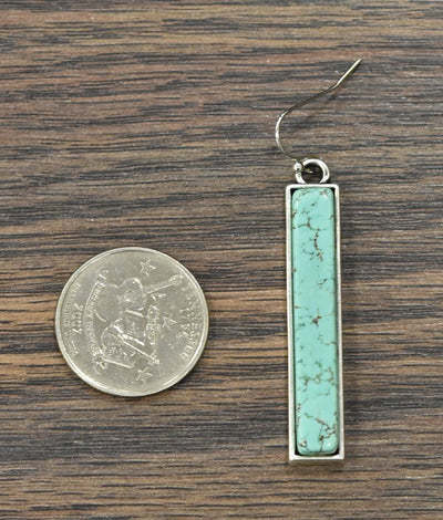 The Marlowe Turquoise Bar Earrings viewed for sizing comparison. 