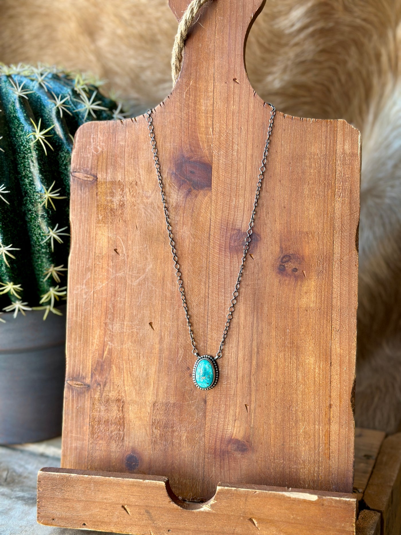 The Marmee Authentic Turquoise Necklace with its striking turquoise oval pendant and adjustable sterling silver chain embodies strength and resilience.