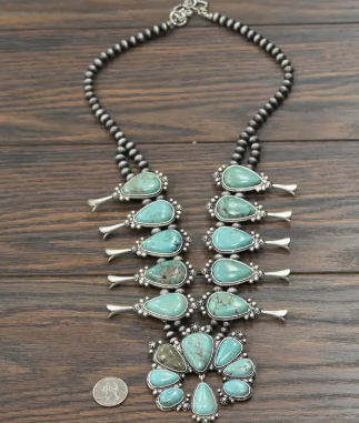 Detailed view of the Marty Squash Blossom Necklace highlighting affordable faux turquoise stones and intricate craftsmanship.