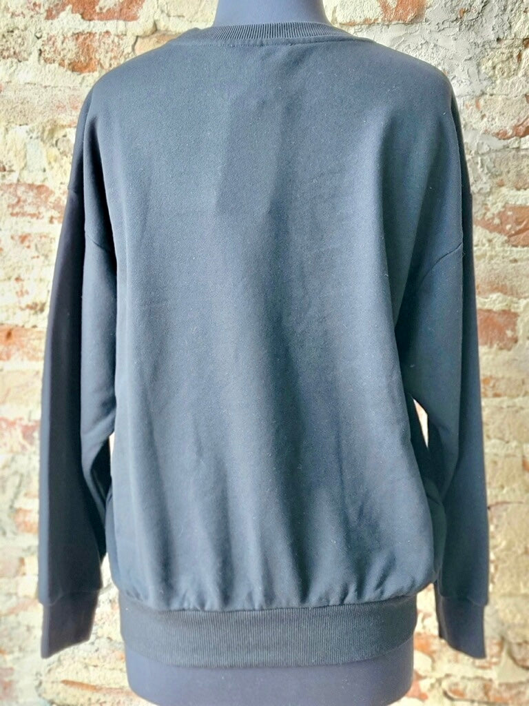 Back view on mannequin of Mauney Bull Rider Crewneck showing length of comfort.