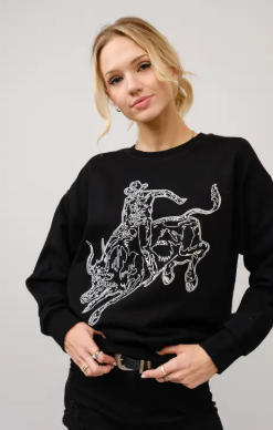 Model in Black Mauney Bull Rider Crewneck with bold embroidered bull riding motif.