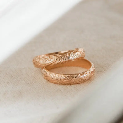 Close-up of Moana Floral Gold Stacker Ring with engraved tooled leather-inspired floral design.