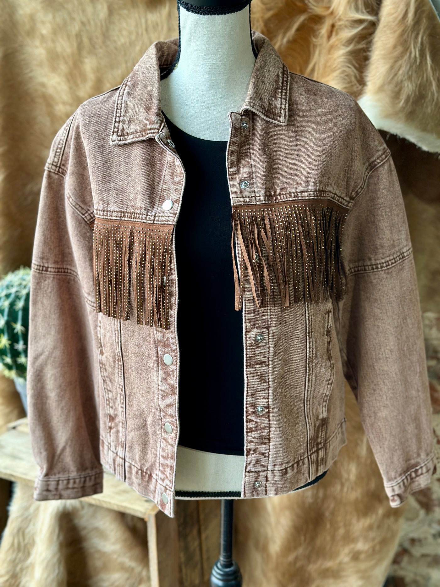 Broker Leather's Close-up of Moose Rhinestone Fringe Jacket showcasing its shimmering rhinestone fringe and Western-inspired design.