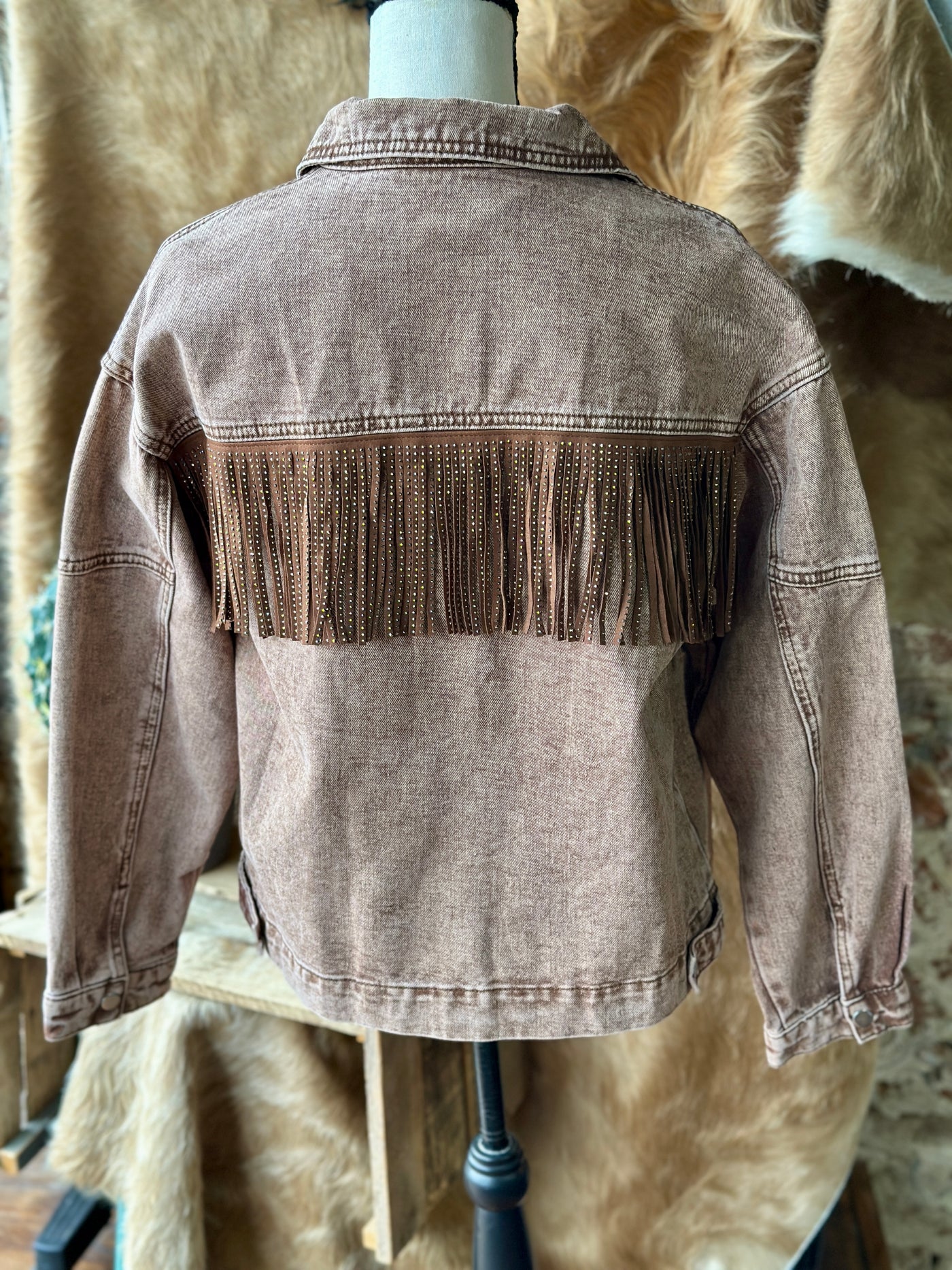 Broker Leather's Moose Rhinestone Fringe Jacket showcasing its shimmering rhinestone fringe and Western-inspired design on the backside.