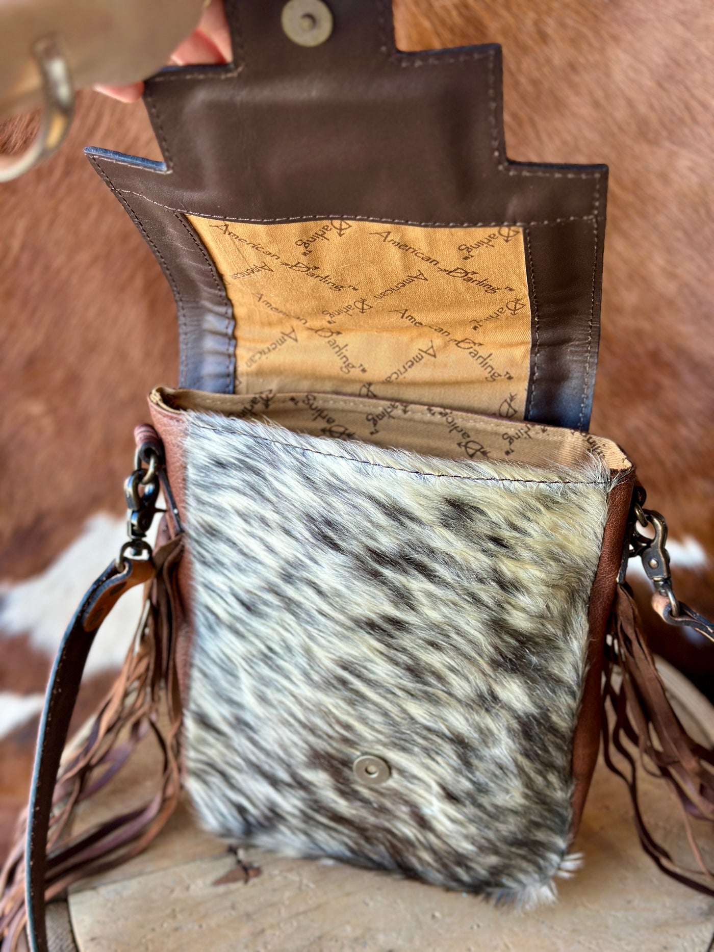 Close-Up of the genuine hair-on-hide section of the Morgan Fringe Crossbody Bag.