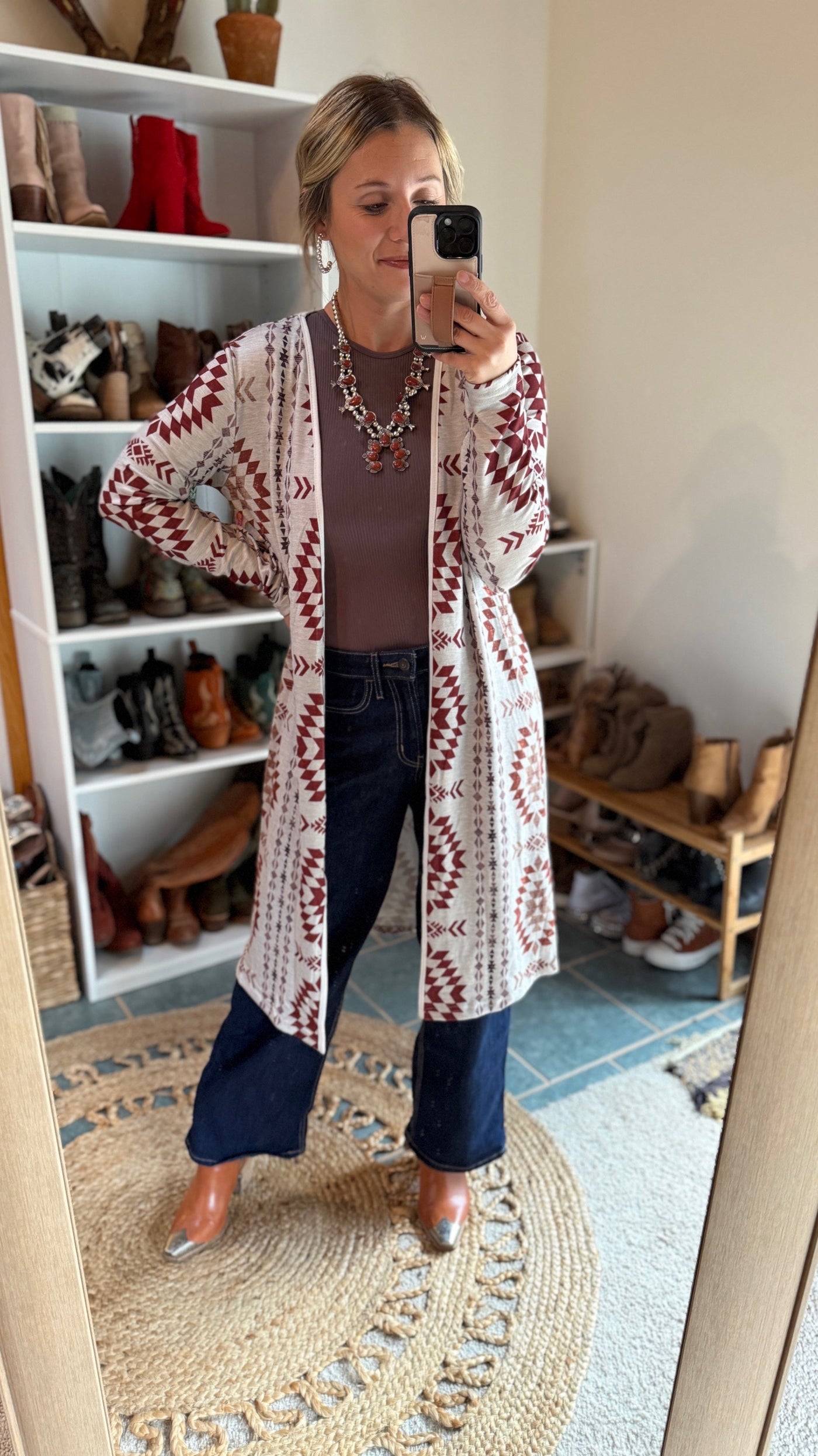 A woman modeling our Muscadine Aztec Open Front Long Cardigan.