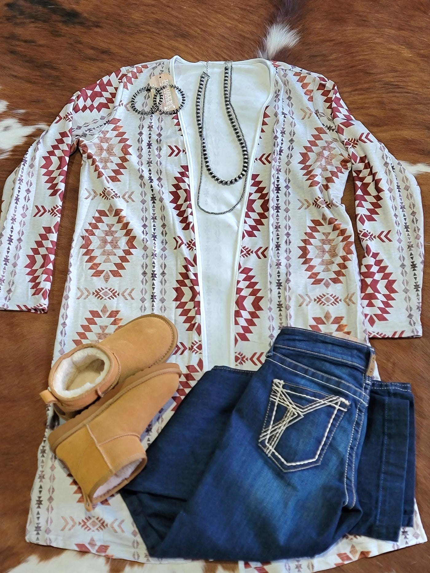 Flatlay photo of an outfit featuring our Muscadine Aztec Open Front Long Cardigan.