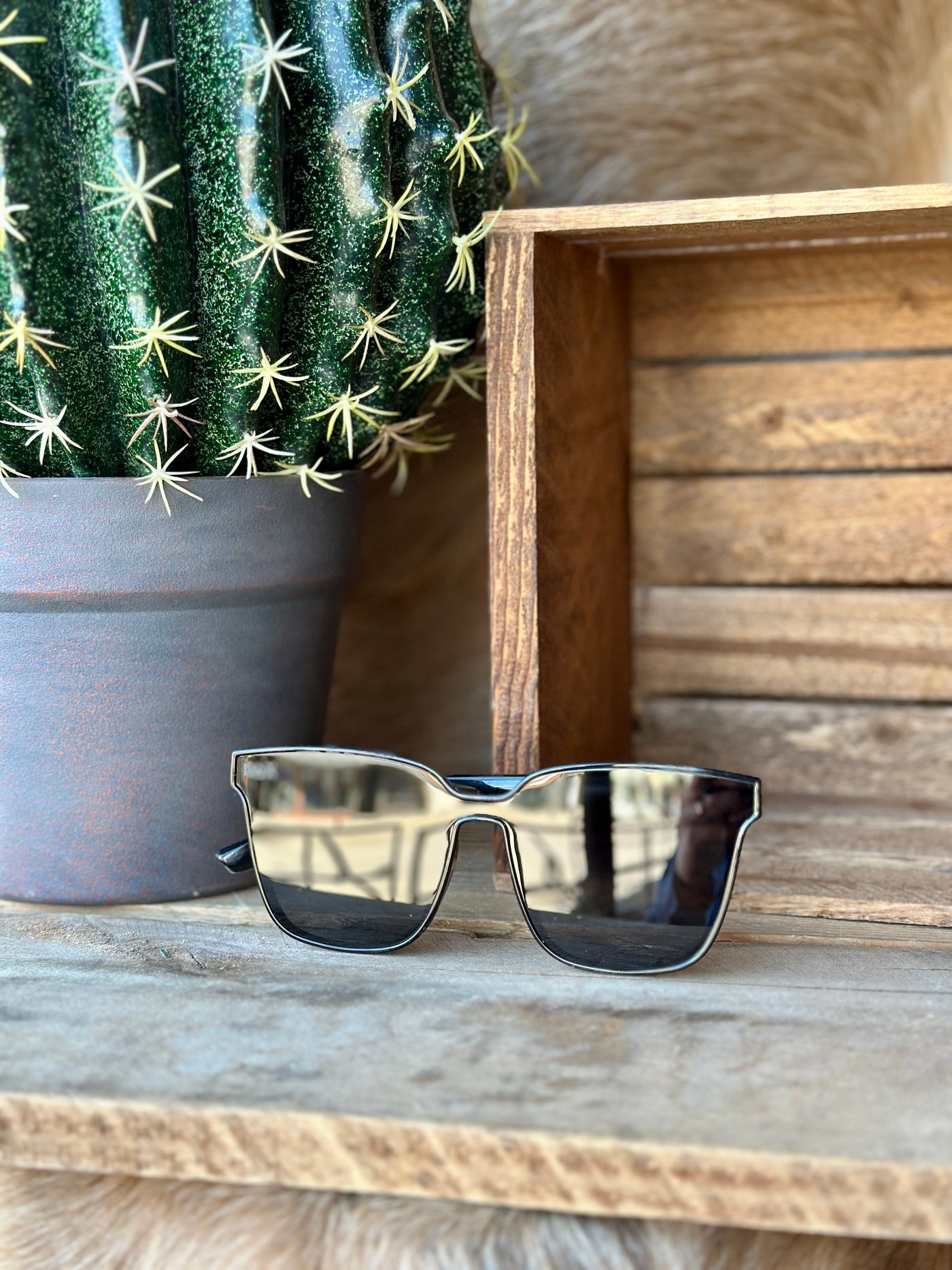 Stylish black sunglasses with bold frames and UV 400 lenses for ultimate sun protection.