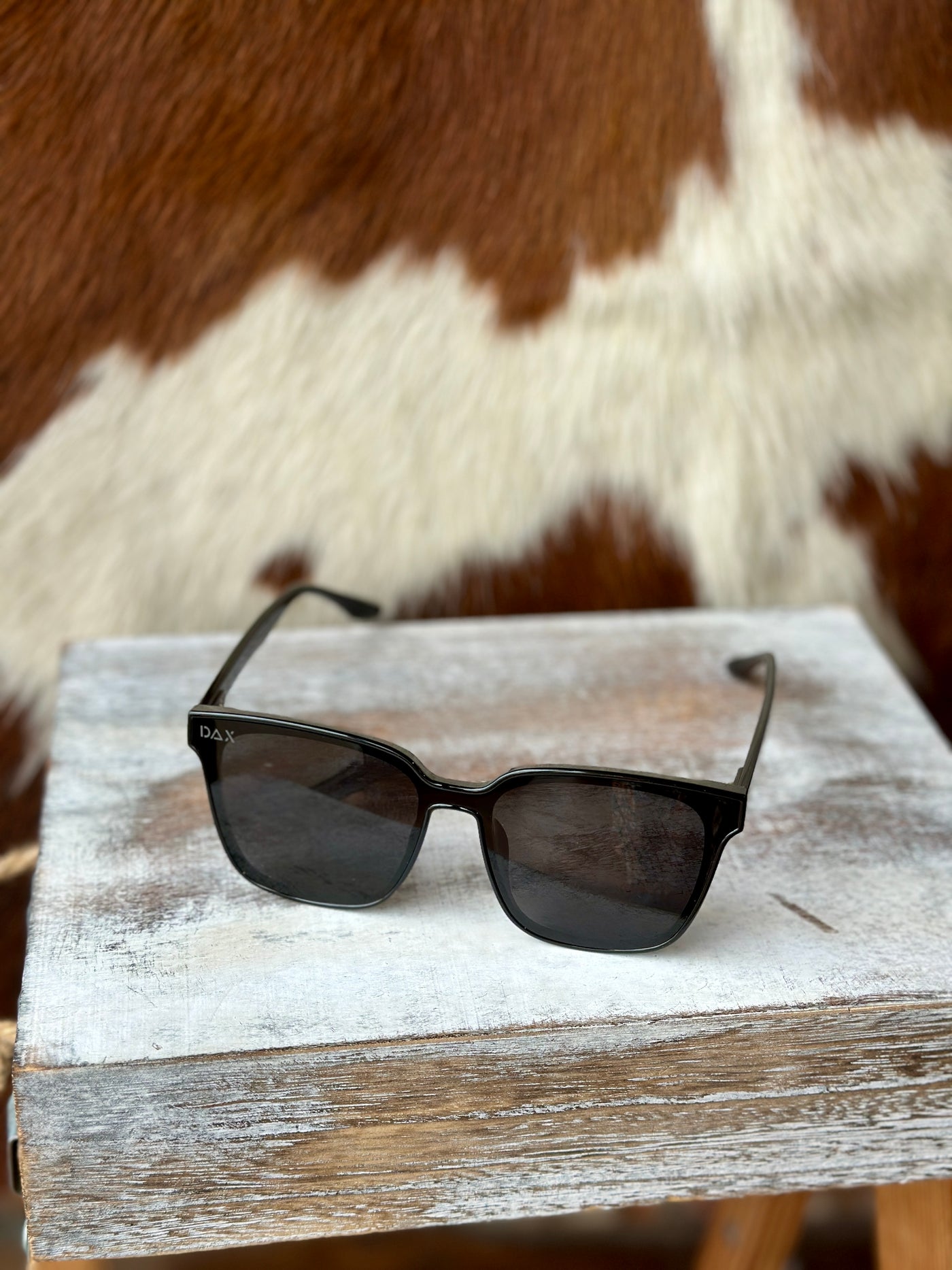 Trendy oversized black sunglasses for cowgirl style and everyday wear.