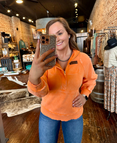 Gracelyn modeling the No Sidelines Quarter Zip Sweatshirt, sized down for a slimmer fit.