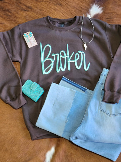 Flatlay outfit featuring the cozy Obsession Custom Broker Crewneck [Brown & Turquoise].