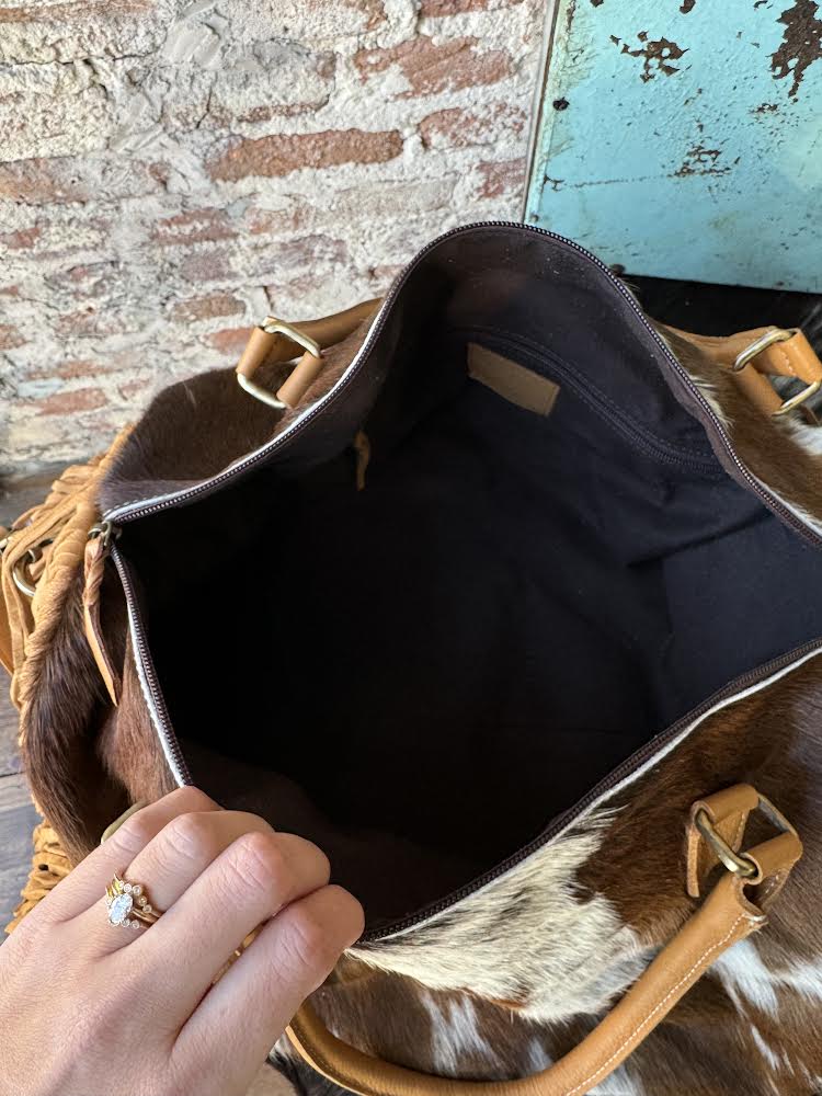 Interior view of Octavia bag showing open and zippered pockets for organization.