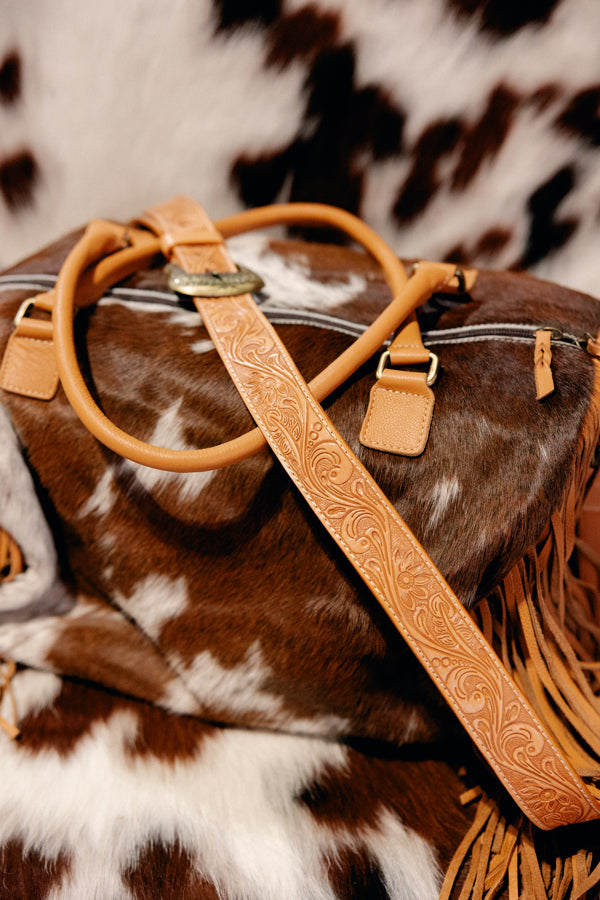 Stylish and functional cowhide duffel bag perfect for weekend adventures.