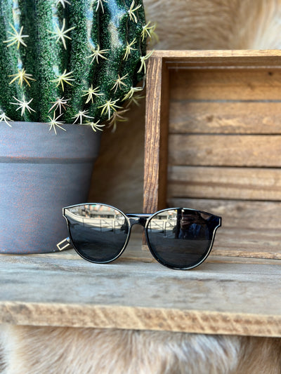 Rodeo-ready black sunglasses with western charm.