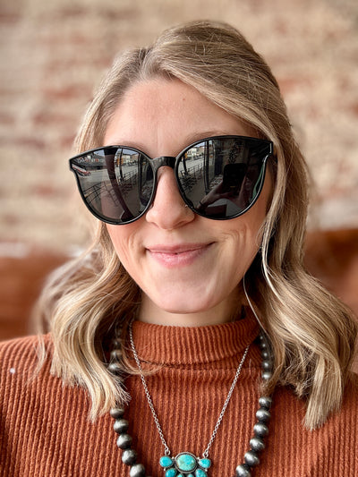 Sleek black sunglasses designed for country concerts.