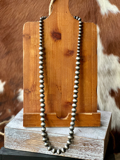 Close-up of Pascal Faux Navajo Pearl Necklace showcasing its antique silver-tone finish and bold pearl design.