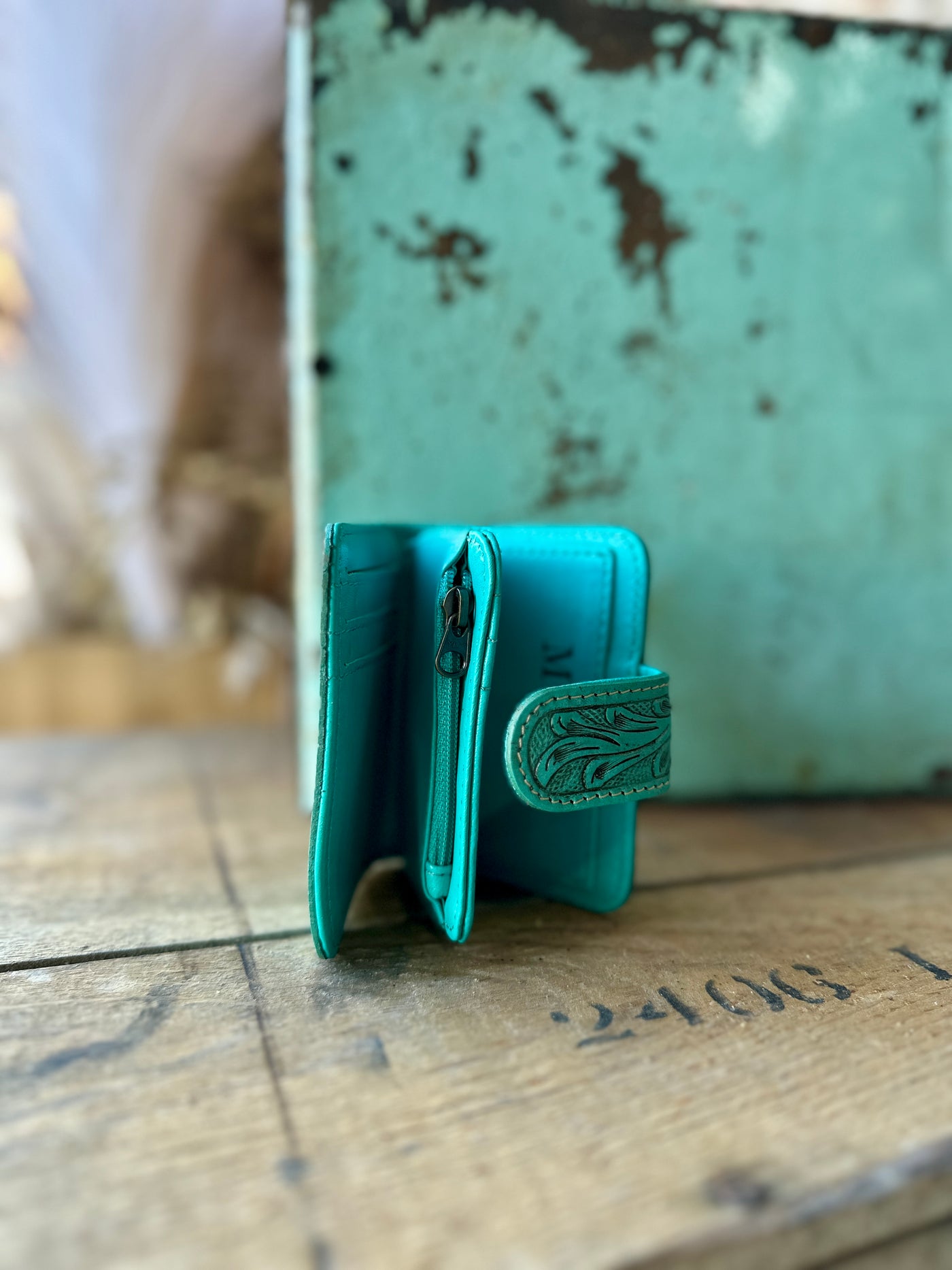 A side view picture of our turquoise Patricia Tooled Leather Cardholder Wallet.