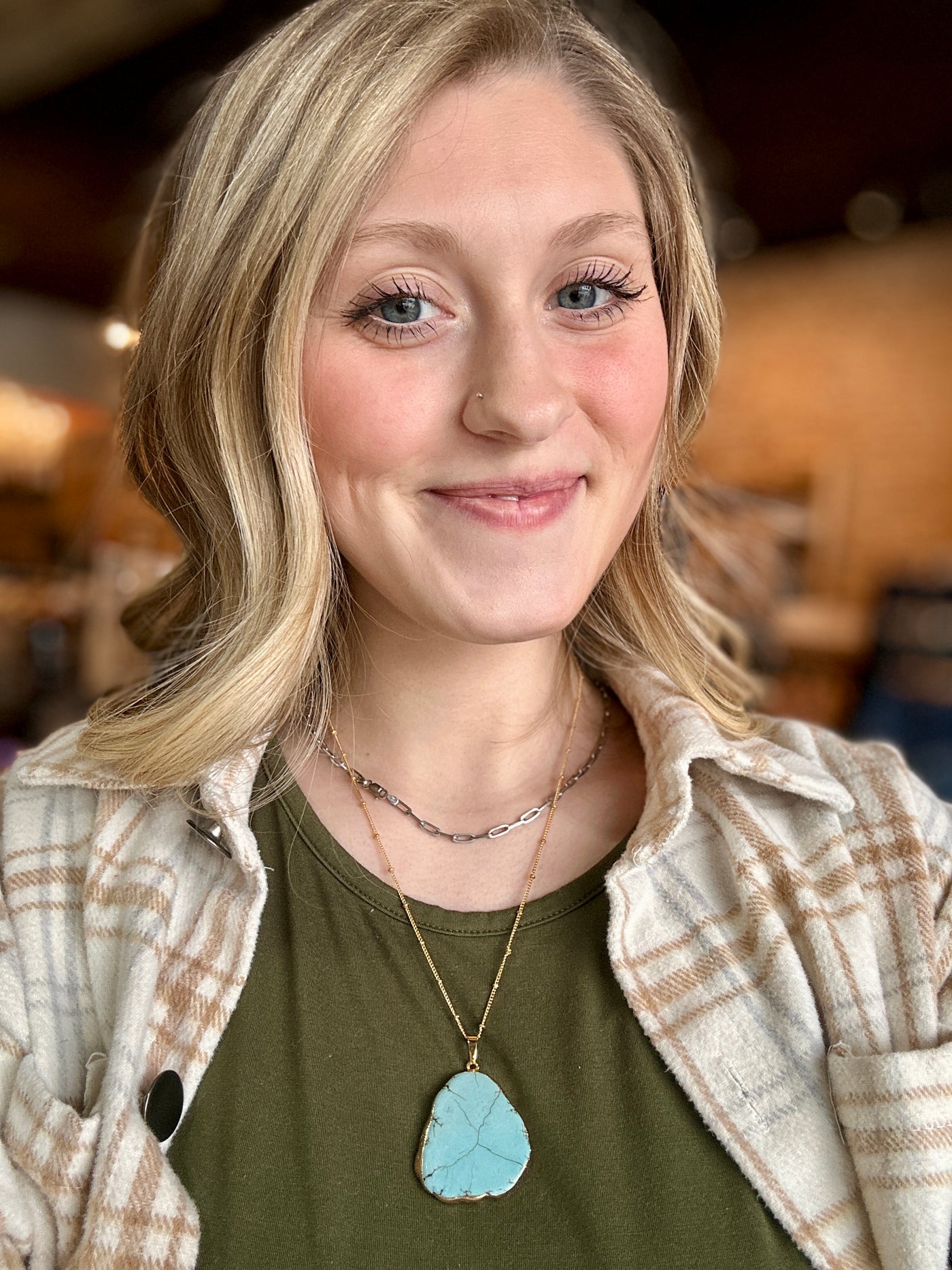 Pendl Turquoise Stone Pendant Necklace worn as a statement piece with a boho outfit.