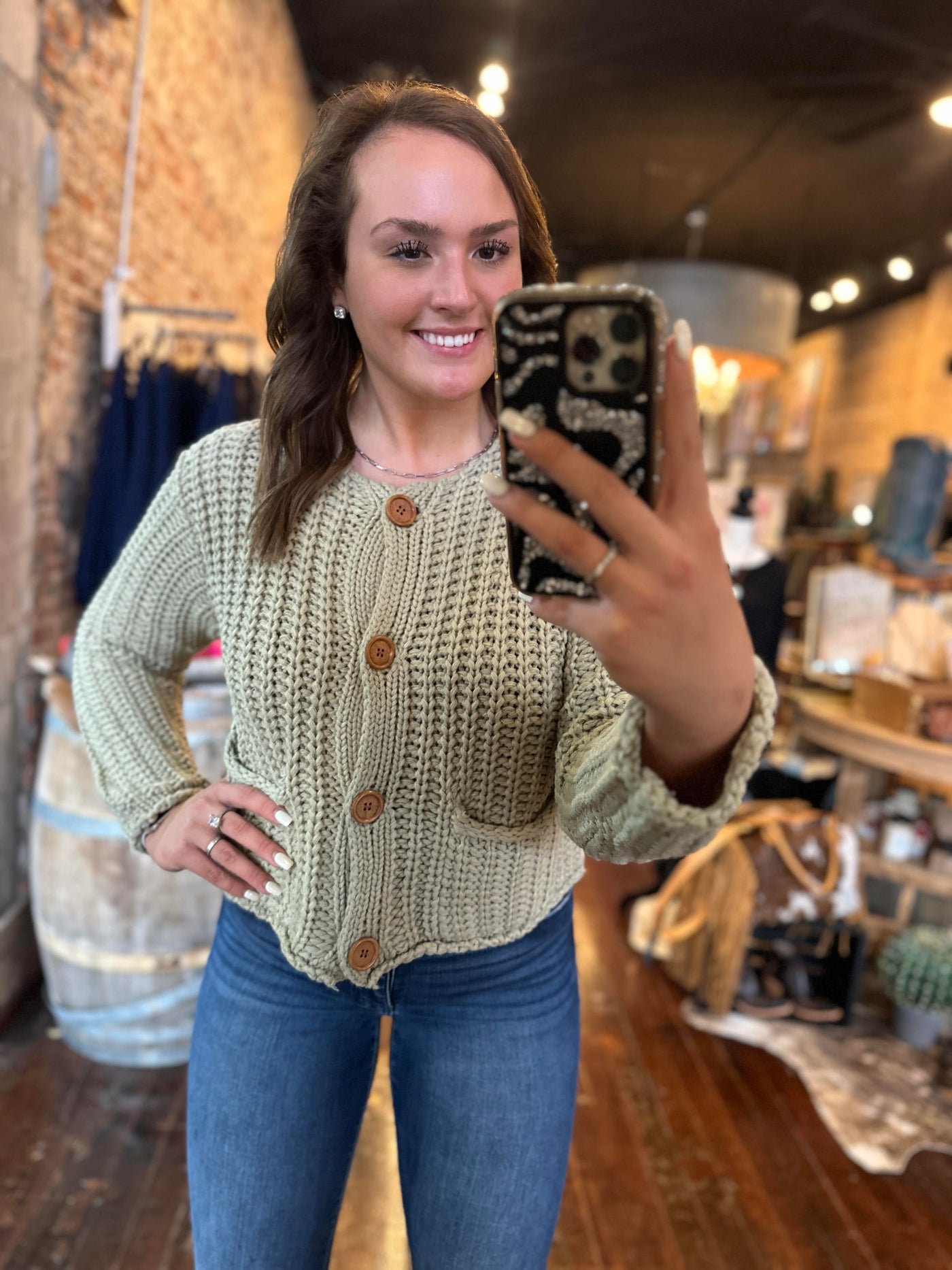 Broker Leather Employee Selfie Modeling our Pistachio Chunky Sweater Cardigan.