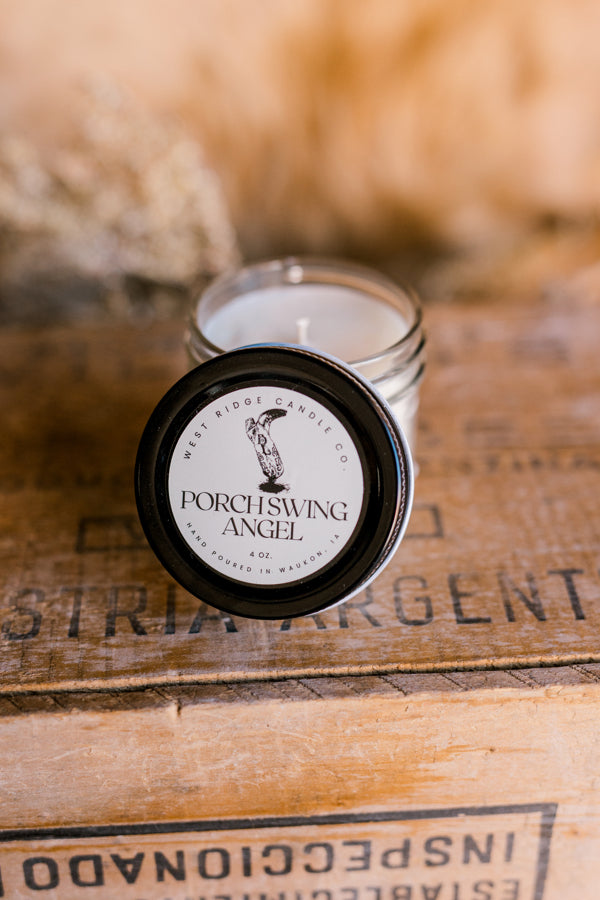 A candle that smells like a classy cowgirl's perfume holding hands with a freshly baked pan of cinnamon rolls.