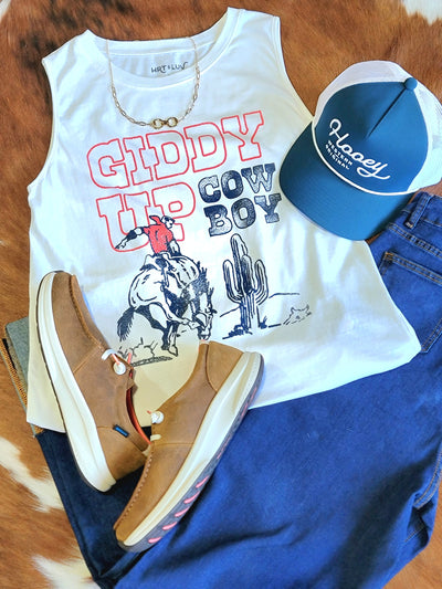 Outfit inspiration featuring the Preston Giddy Up Tank showcasing a patriotic rodeo-inspired print, a Hooey cap, & Ariat jeans and shoes.