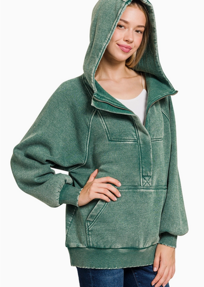 A stock photo with a model showcasing our Half Zip Puddles Mineral Wash Sweatshirt [Green].