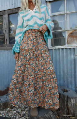 Model in versatile Raen Daisy Floral Maxi Skirt made in the USA, perfect for festivals or sunny days.