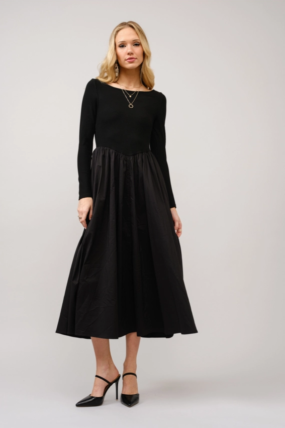 Raven Black Boat Neck Maxi Dress styled with minimal accessories for effortless elegance.