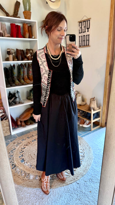 Raven Black Boat Neck Maxi Dress styled with minimal accessories for effortless elegance.