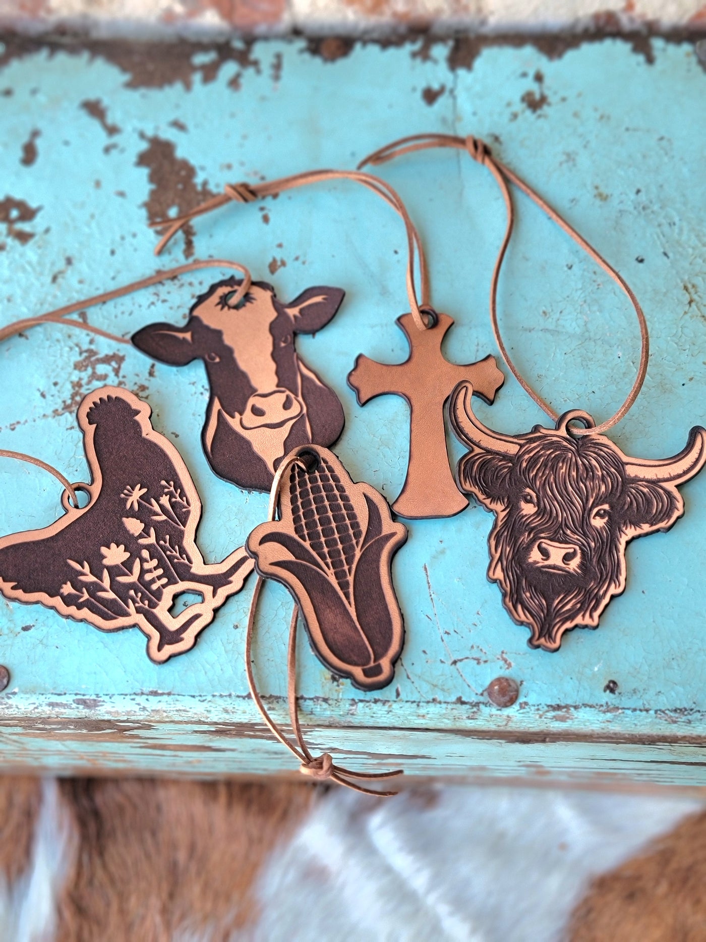 Refillable western-scented leather air fresheners to hang from your rearview mirror.