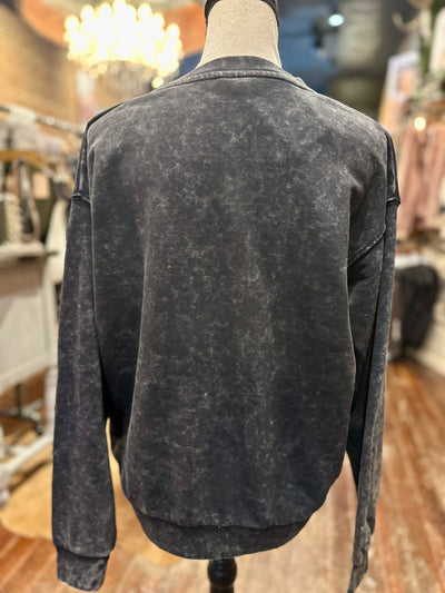 Backside view of the mineral-washed Howdy sweatshirt, showcasing its lightweight and cozy fit.