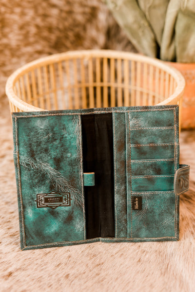 Broker Leather's Ricardo Floral Tooled Organized Wallet [Aqua] features multiple compartments for optimal organization.