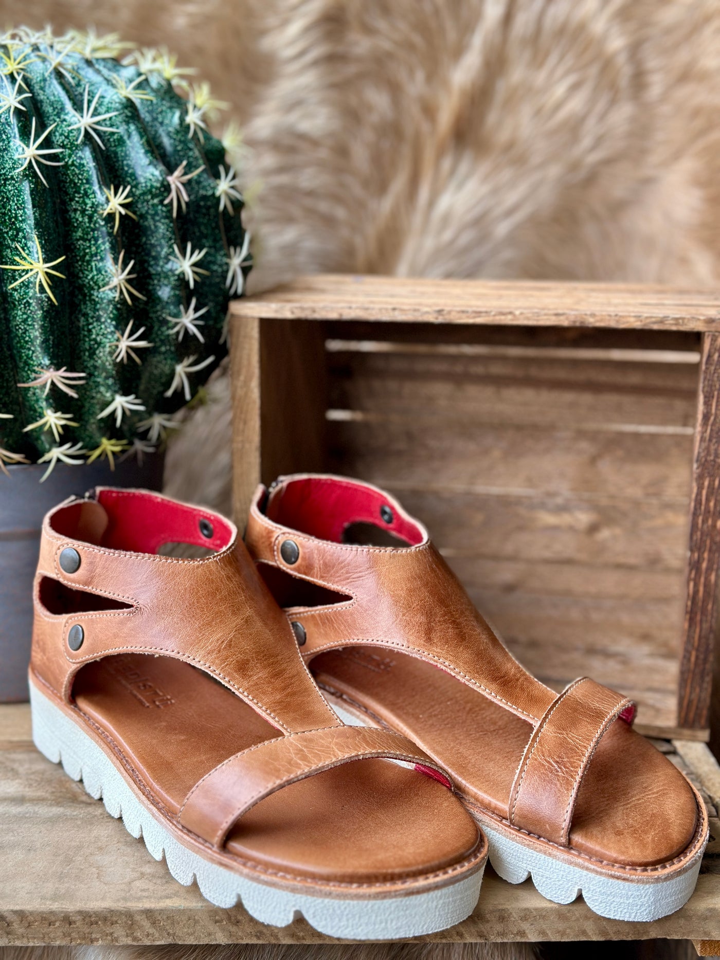 Top-down view of rustic tan Soni II sandals showing strappy design and breathable leather insole