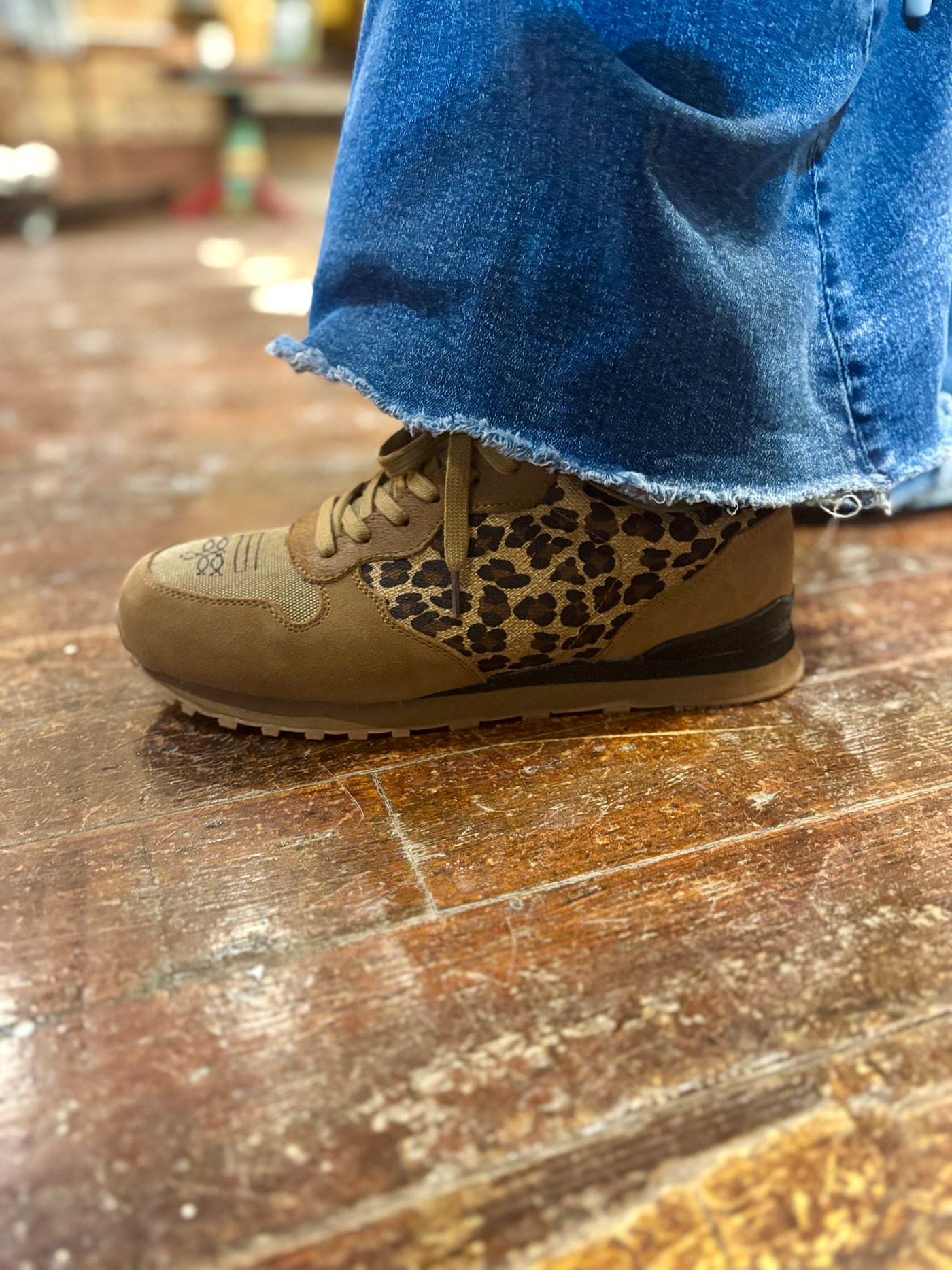 Leopard print accent on sides of the Roper Giddy Up Shoes, paired with a western-inspired outfit for a bold statement look.