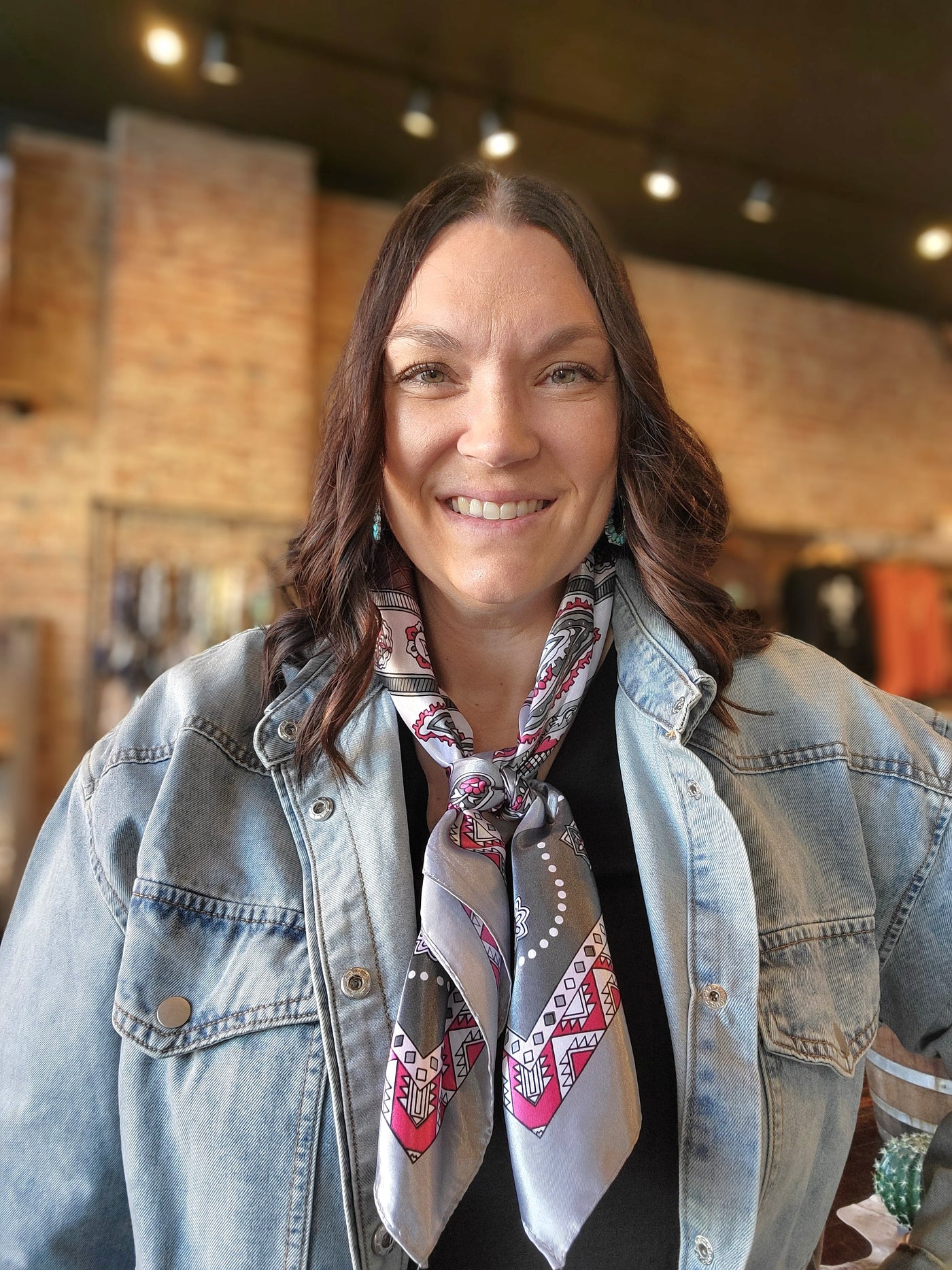 Woman modeling our Rossio Paisley Wild Rag [Grey & Pink].