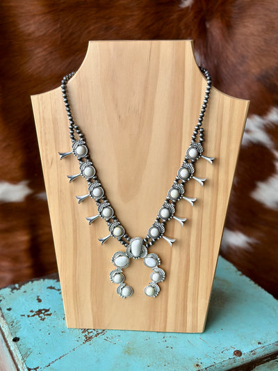 The RumChata White Stone Squash Blossom Necklace on display, with a mix of natural stones and antique silver elements for a timeless look."