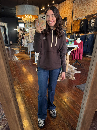 View of Ryggen Genuine Cowhide Slippers with comfortable pile lining and durable sole peeking out from underneath model's jeans.