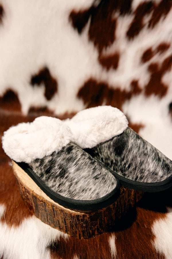 Full view of Ryggen Genuine Cowhide Slippers with soft pile lining, offering a cozy fit and unique cowhide design.