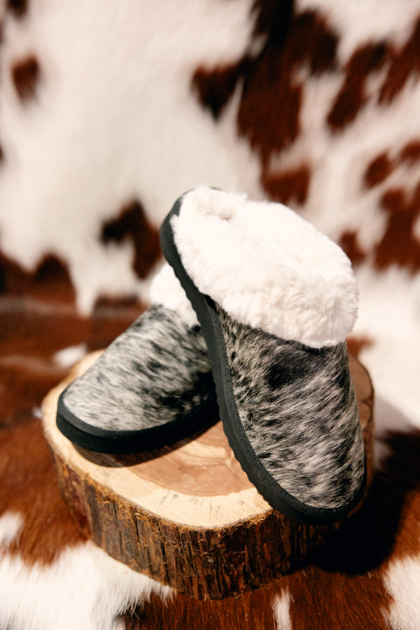 Detailed close-up of salt & pepper Ryggen Genuine Cowhide Slippers showing unique cowhide pattern and plush interior.