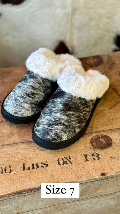 Ryggen Genuine Cowhide Slippers on display, designed for comfort with plush lining and genuine cowhide exterior.