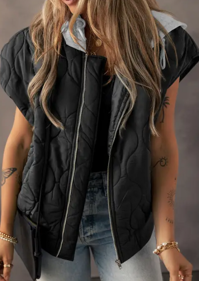 Stock photo of model showcasing the front side of our Celebrity Shot Quilted Vest [Black].