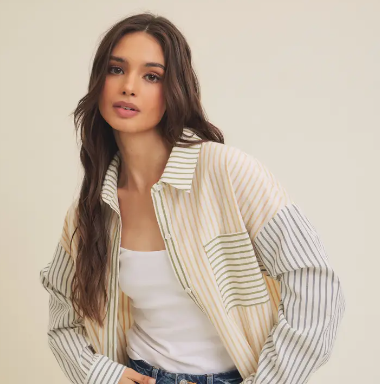 A close up stock image of a model styling our Bryan Stripe Button Down Blouse Shirt on a mannequin.