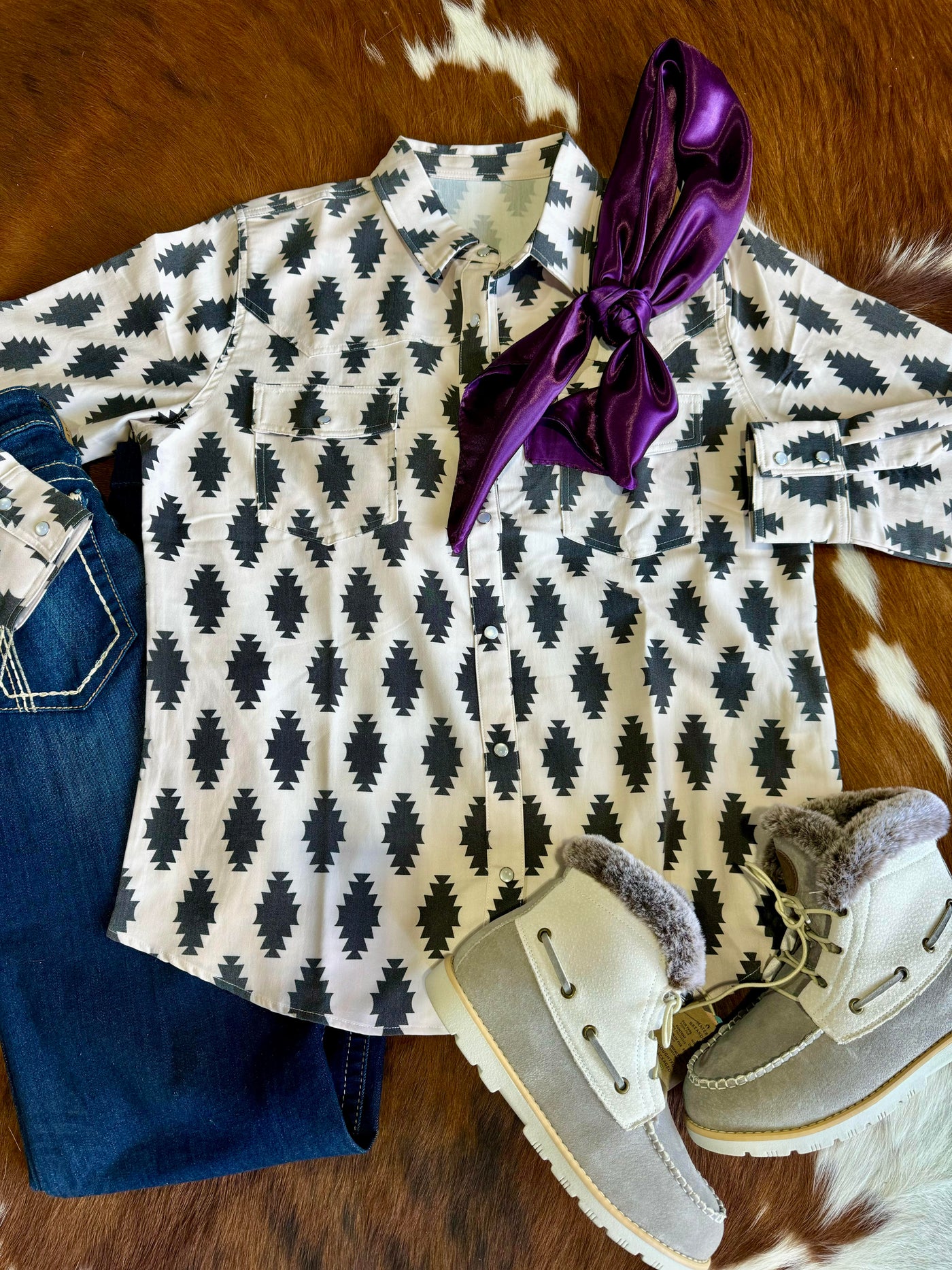 Styled flat lay featuring the Sheila Black Aztec Pearl Snap alongside boots and a wild rag for a warm Western outfit.