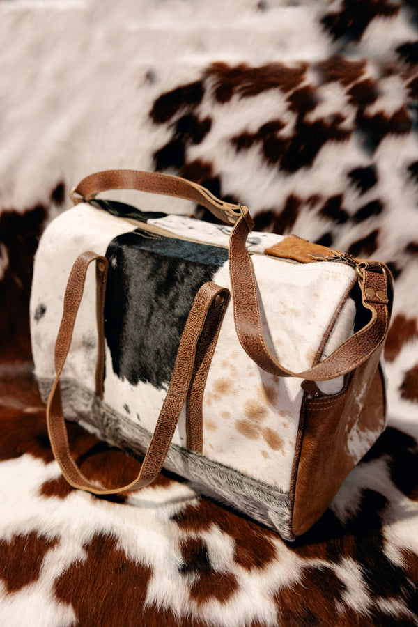 Chic and stylish Sigmund Cowhide Weekender, perfect for weekend getaways or travel.